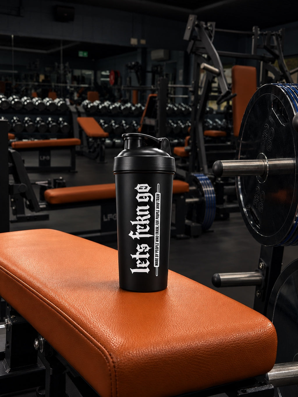 LETS FCKN GO shaker beside gym weights