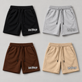 Four shorts in Black, Grey, Brown and Beige with logos on viewer-right