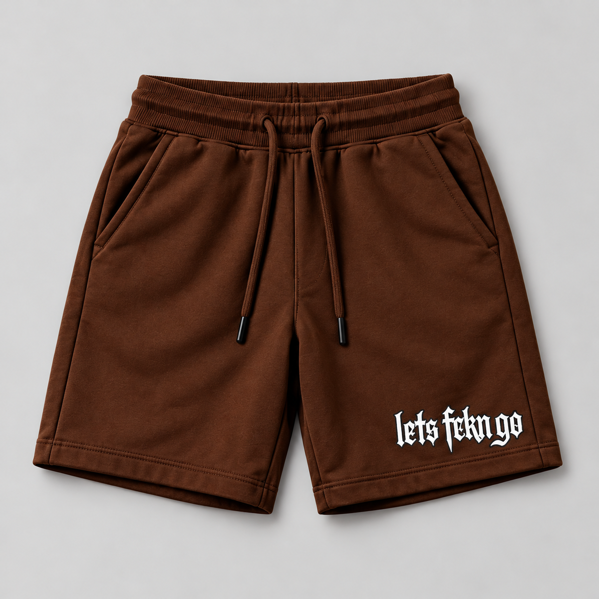 brown shorts with logo on right as viewed