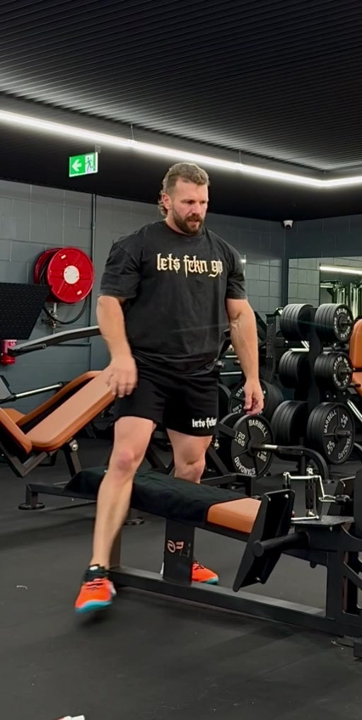 Jake wearing the black LETS FCKN GO Washed Tee at the gym