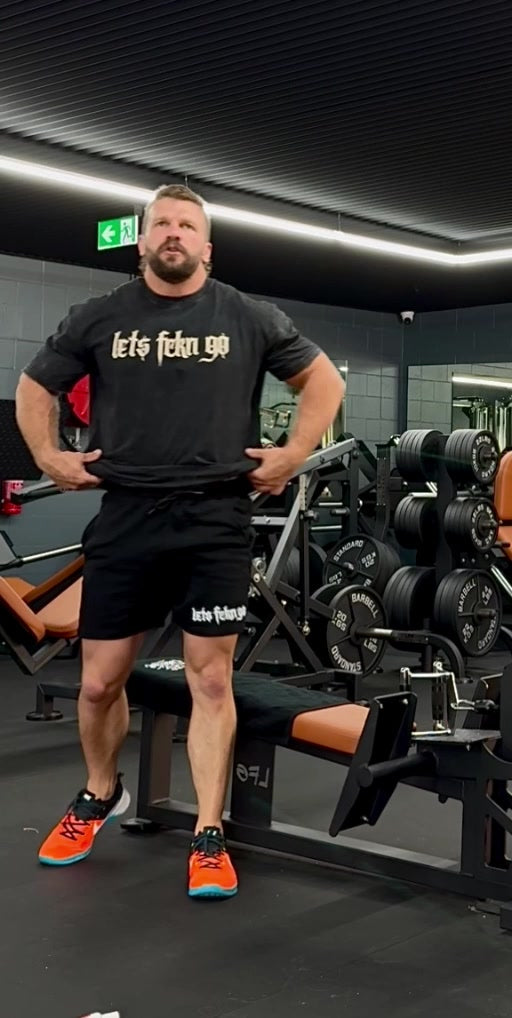 Jake wearing the black LETS FCKN GO Washed Tee at the gym