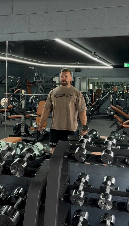 Jake wearing the brown LETS FCKN GO Washed Tee at the gym